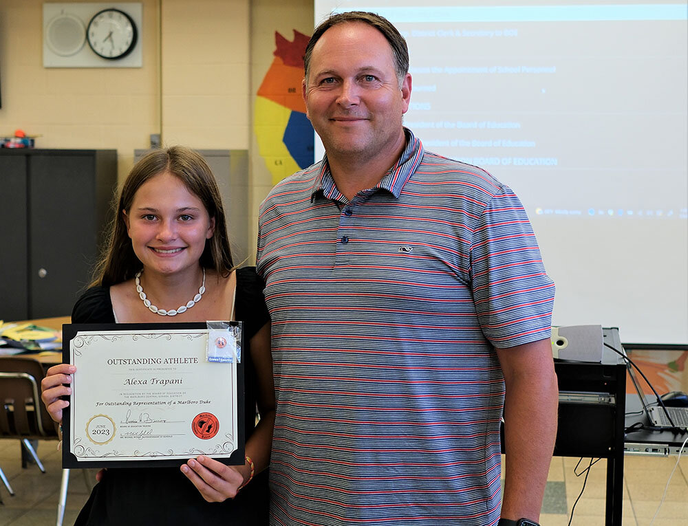 Middle School Outstanding Athlete in Golf Alexa Trapani, stands next to her coach, Gary Trapani.